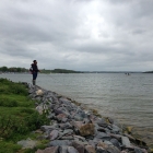 Ashly fishing off the sailing club bank.
