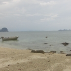 On one of many islands, Ashly trying to spot fish under water